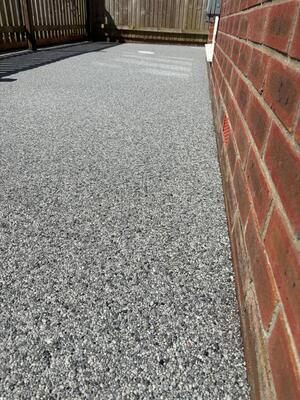 Close up view of new resin bound surface laid at property in Loughor Swansea by RNM Resins
