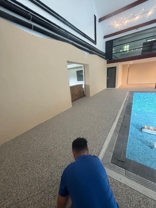 RNM Resin team busy installing resin bound pool surround in Pantyffynon Ammanford