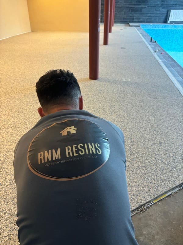 RNM Resins expert installer surfacing pool surround with resin bound mix at property in Pantyffynon Ammanford